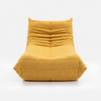 Caterpillar Cream Chaise Lounge in Yellow with sculptural curved lounge design