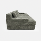 Side view of Lune Corduroy Horizon Sectional Sofa with wide arms and deep lounge seat
