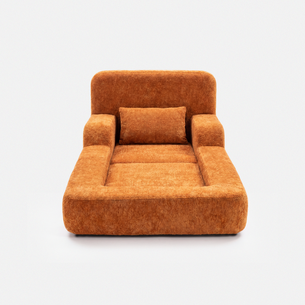 Mimi Kids Lounge Chair in Tangerine with cushioned seat, armrests, and soft pillow