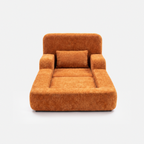 Mimi Kids Lounge Chair in Tangerine with cushioned seat, armrests, and soft pillow