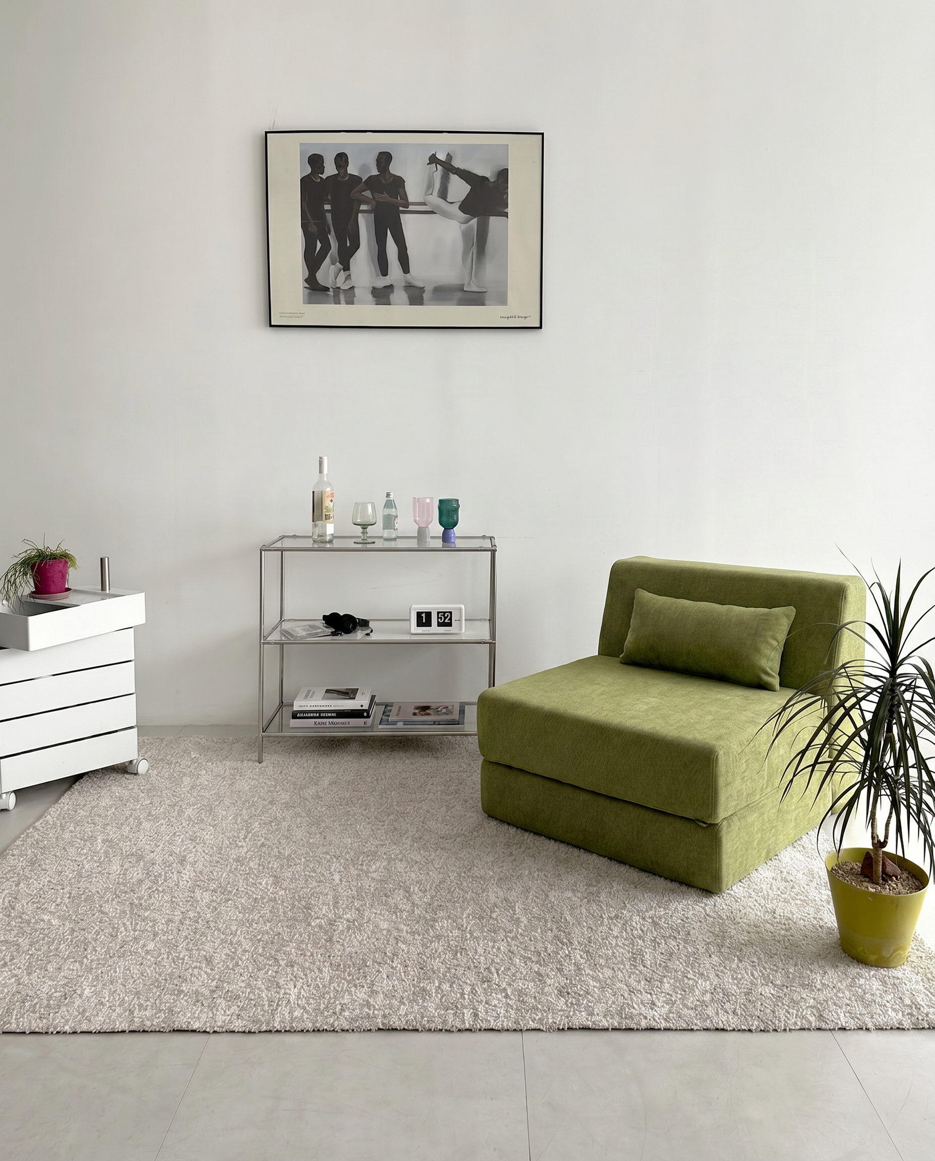 Convertible Lounge Chair Bed in Moss styled in a clean modern living room