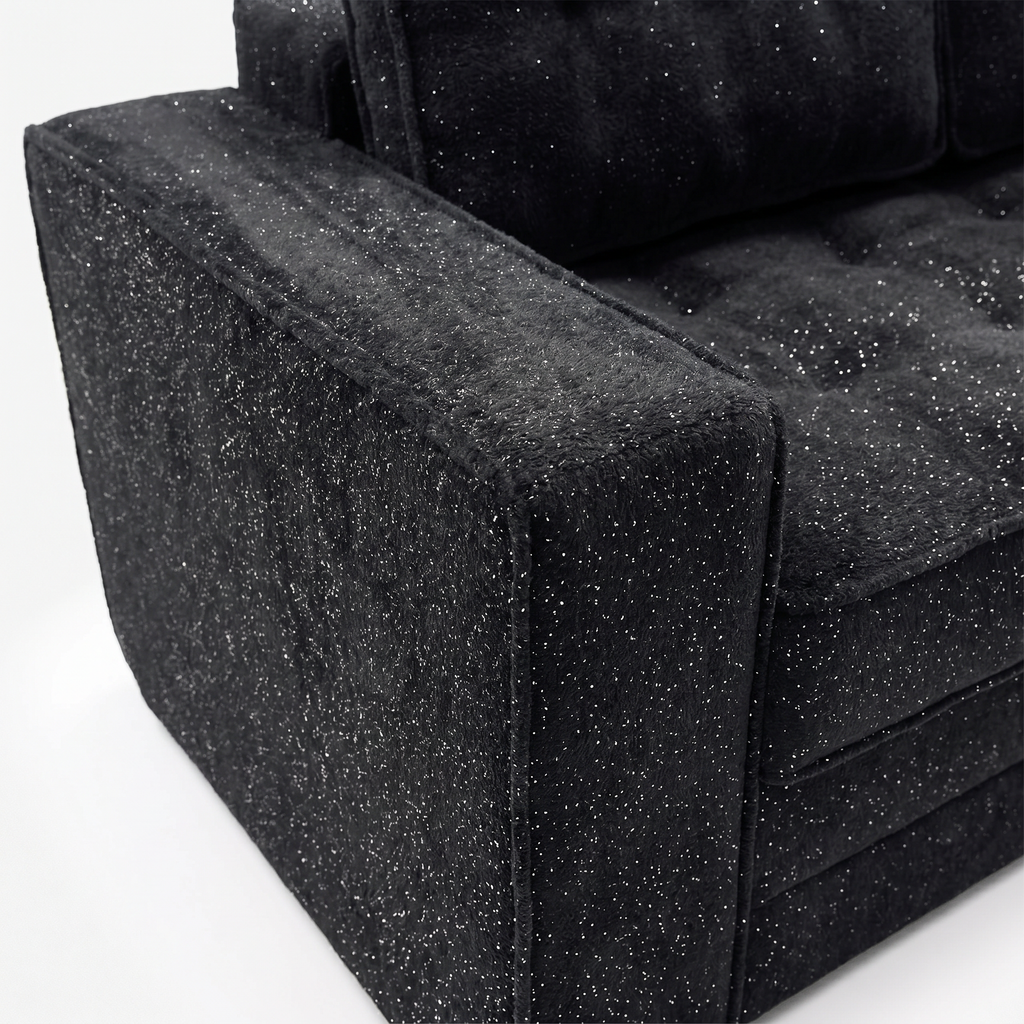 Milo Plush Sleeper Loveseat in Black with plush armrest and fabric detail