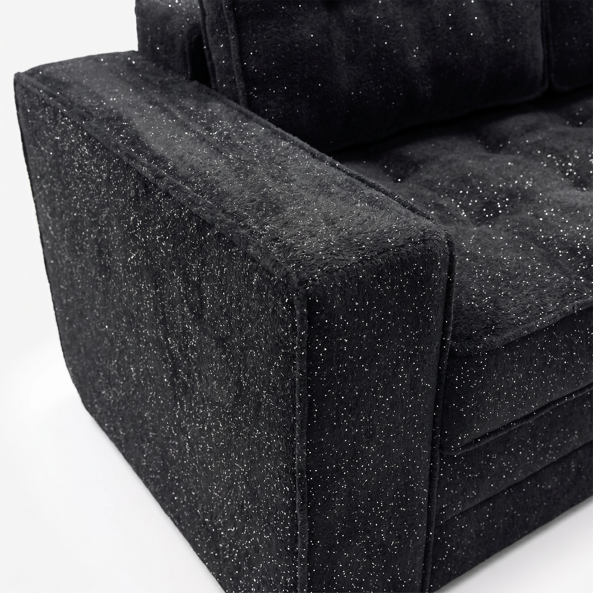 Milo Plush Sleeper Loveseat in Black with plush armrest and fabric detail
