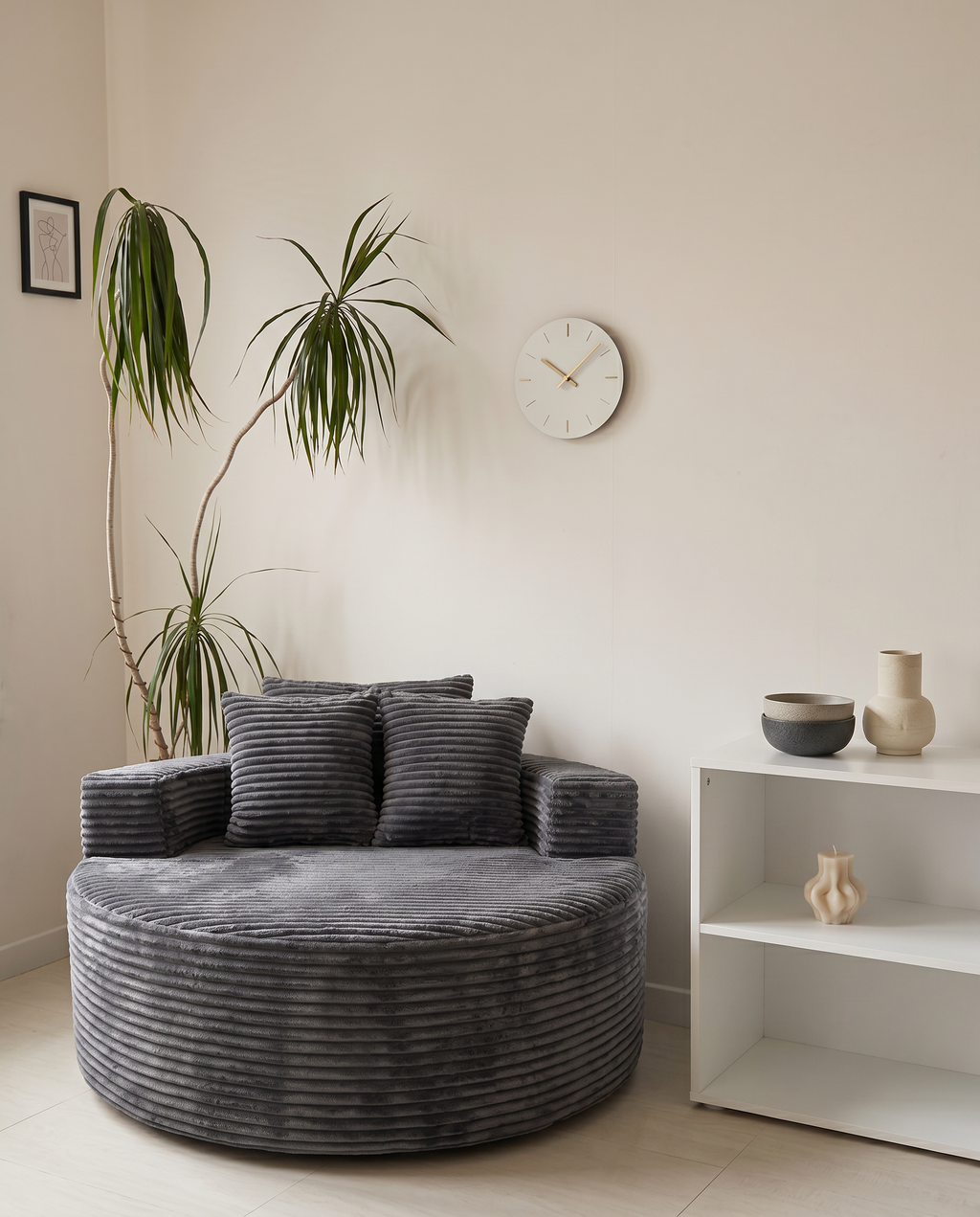 Noma Charcoal Deep Lounge Chair styled in a cozy modern living room