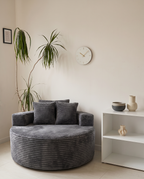 Noma Charcoal Deep Lounge Chair styled in a cozy modern living room